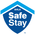 Logo for AHLA's Safe Stay program featuring a blue shield and house silhouette.